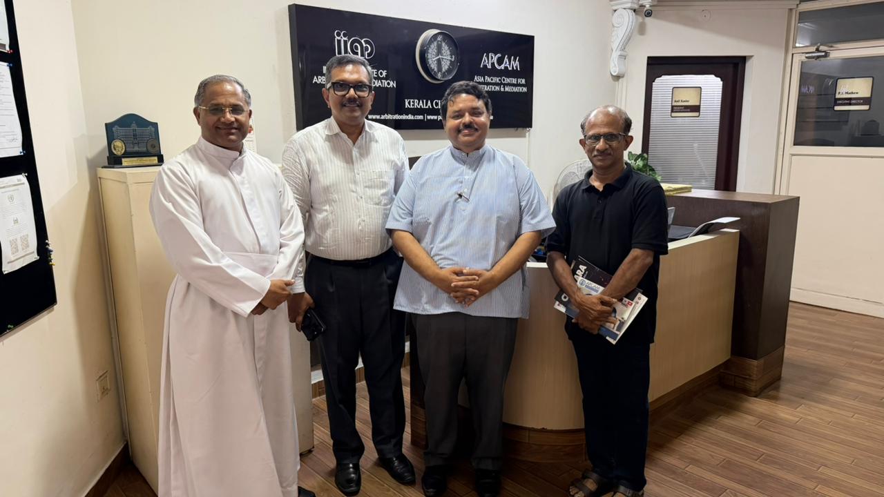 The M Team and Fr. Roby at IIAM